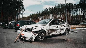 Irpin, Kyiv region, Ukraine - 28 April 2022.  Car graveyard in Irpin, consequences of the invasion of the Russian army in Ukraine. photo