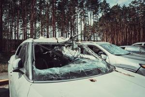 Irpin, Kyiv region, Ukraine - 28 April 2022.  Car graveyard in Irpin, consequences of the invasion of the Russian army in Ukraine. photo