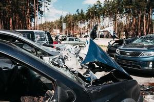Irpin, Kyiv region, Ukraine - 28 April 2022.  Car graveyard in Irpin, consequences of the invasion of the Russian army in Ukraine. photo