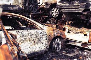 Irpin, Kyiv region, Ukraine - 28 April 2022.  Car graveyard in Irpin, consequences of the invasion of the Russian army in Ukraine. photo