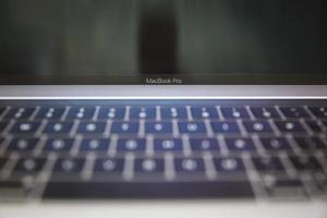 Belgrade, Serbia, 2020 - Detail of MacBook Pro computer isolated on white. The MacBook is a brand of notebook computers manufactured by Apple Inc. photo