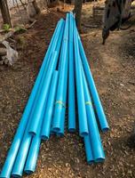 The new PVC pipe pile near the construction site for the preparation of the water supply system. photo