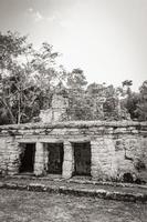 Ancient Mayan site with temple ruins pyramids artifacts Muyil Mexico. photo