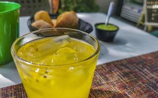 Passion fruit juice in restaurant PapaCharly Playa del Carmen Mexico. photo