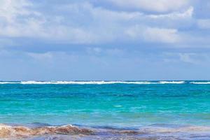 Waves water caribbean coast and beach panorama view Tulum Mexico. photo