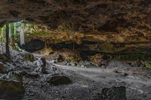 Blue turquoise water limestone cave sinkhole cenote in Chemuyil Mexico. photo