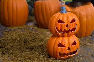 Craved pumpkin head jack lantern is decorated with scary theme in Halloween holiday. photo