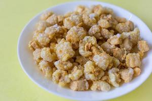 Pork crackling pork snack, pork scratching is fried pork skin as snack and we can eat it with noodles in Thai food style. photo