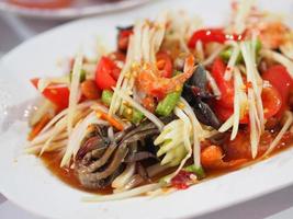 Green papaya salad put pickled crab and Pickled fish photo