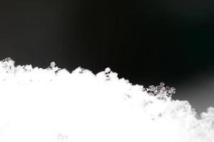 different snow crystals and black photo