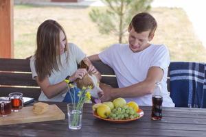 Young couple with beagle dog, happy family have good time in backyard photo