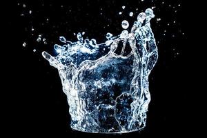 Abstract background of Water splashing on a black background. idea for freshness photo