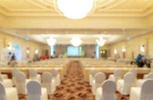 Blurred background of business seminar and conference event hall. Empty chairs at corporate meeting and presentation event in convention hall. People at seminar and meeting room. Staff at seminar. photo