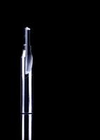 Special tools isolated on black texture background. Made to order special tools. Sharp reamer detail. HSS cemented carbide. Carbide cutting tool for industrial applications. Engineering tools on dark. photo