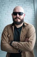 Portrait of a bald man in a shirt with a beard photo