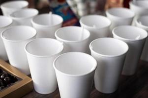 A group of empty coffee cups to serve tea or coffee at an event buffet photo