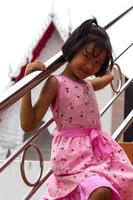 Girl with stainless steel railings. photo