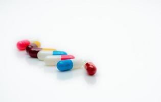 Selective focus antibiotic capsule pills on white background. Antibiotic drug resistance. Pharmacy web banner. Pharmaceutical industry. Prescription drugs. Superbug problems. Medicament and health. photo