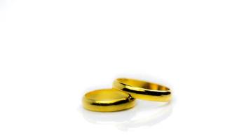 Two gold wedding ring isolated on white background with copy space, just add your own text photo