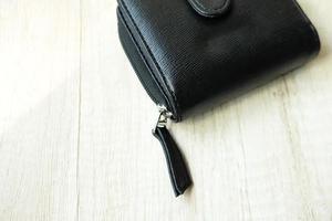 Women's purses on a wooden table photo