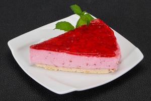 Soft Raspberry cheesecake served mint photo