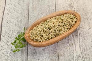 Peeled hemp seeds in the bowl photo