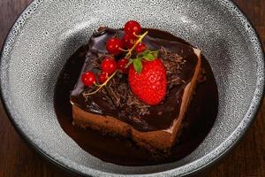 Sweet chocolate cake served strawberry photo