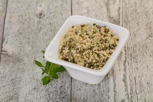 Peeled hemp seeds in the bowl photo
