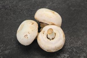 Raw Champignon heap for cooking photo