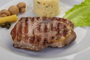 Grilled pork neck steak photo