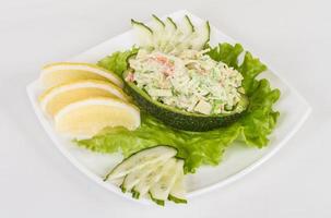 Crab meat salad with green caviar in avocado - japan cusine photo