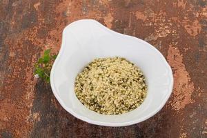 Peeled hemp seeds in the bowl photo