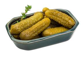 Marinated cucumbers, pickles in a bowl photo