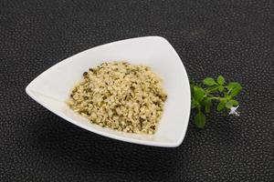 Peeled hemp seeds in the bowl photo