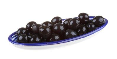 Olives black watered with olive oil in a bowl isolated on a white background photo