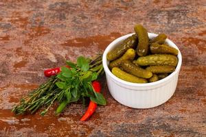 Pickled small cucumbers photo