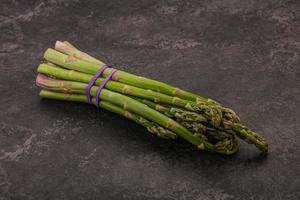 Vegan cuisine - Raw asparagus heap photo