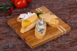 Bruschetta with various cheeses photo