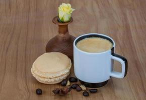 Coffee with macaroons and rose photo