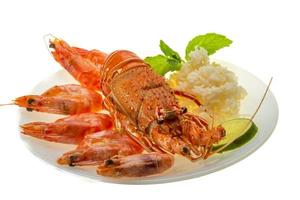 Spiny lobster, shrimps and rice photo