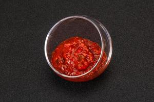 Tomato spicy sauce in the bowl photo