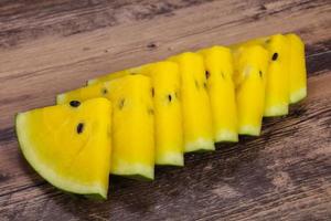 Sliced sweet tasty yellow watermelon photo