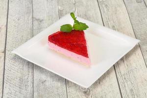 Soft Raspberry cheesecake served mint photo