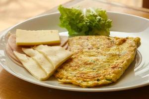 Omelet with cheese and salad photo