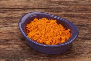 Tumeric powder in the bowl photo