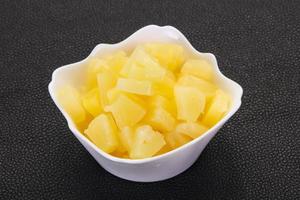 Marinated pineapple pieces photo