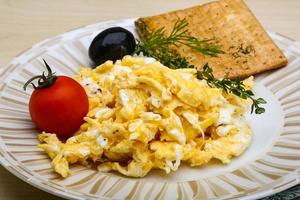 Scrambled eggs with tomato photo