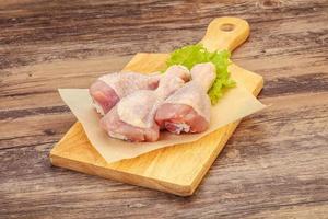 Raw chicken drumsticks for cooking photo