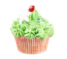 Studio isolated creamy green cupcake photo