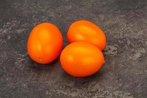 Tasty vegetables - Yellow tomato heap photo